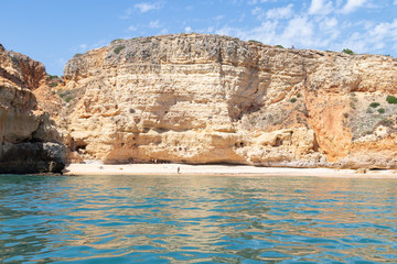 Fototapeta na wymiar View from the sea of Carvoeiro beach. The Lagoa region has a coastline formed of towering cliffs, turquoise waters and picturesque beaches. The beaches of Carvoeiro are found within sheltered coves