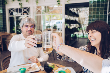 Group of friends cheering at a restaurant during a celebration