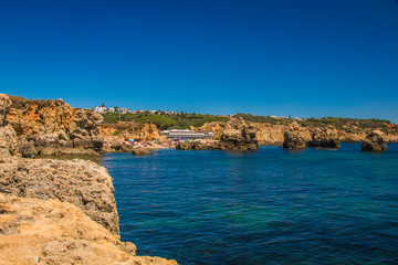 Coastline views with cliffs and small reserved  beaches in the Algarve, Portugal