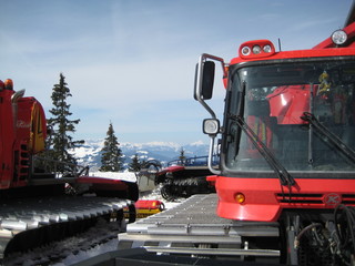 snow cats parking in the mountains