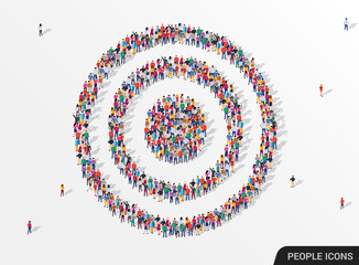 Large group of people seen from above gathered together in the shape of a target.