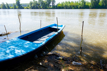 Fototapeta premium Makeshift pier on polluted river coast