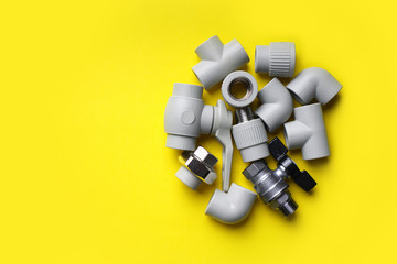 Plumbing pipe details on a yellow background. Copy space.