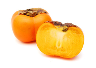 Ripe persimmon with cut isolated on white background