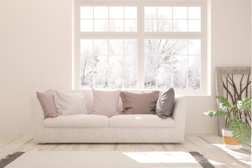 White stylish minimalist room with sofa and winter landscape in window. Scandinavian interior design. 3D illustration