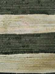 Knitted wool texture. Weaving horizontal strakes.  White and black. Fragment of carpet. 