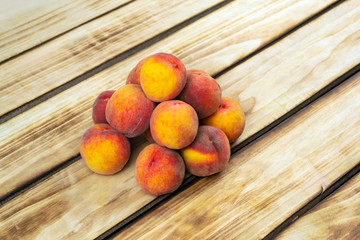 Heap of peaches close up. Wooden