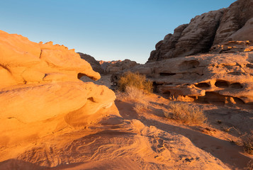 Fototapeta na wymiar Rocks and sand in the Wadi Rum desert in Jordan at sunset