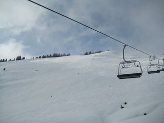 ski lift in winter on a cloudy sunny day