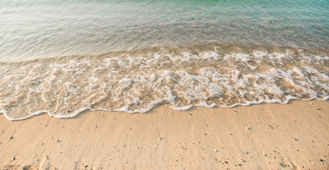 Wave of the sea on the sand beach