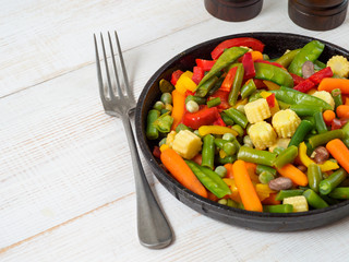 Fresh vegetables fried in the pan.