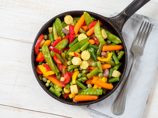 Fresh vegetables fried in the pan.