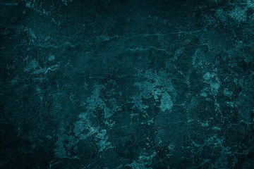 Texture, background of dark surface of blue mineral, wall or ice at close range