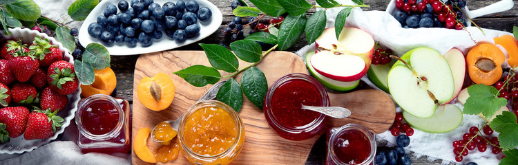 Assortment of jams and seasonal berries, fruits