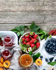 Assortment of jams and seasonal berries, fruits
