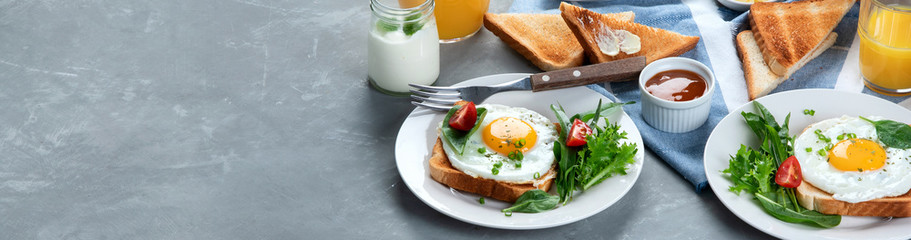 Traditional American breakfast on grey background