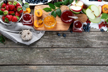 Assortment of jams and seasonal berries, fruits