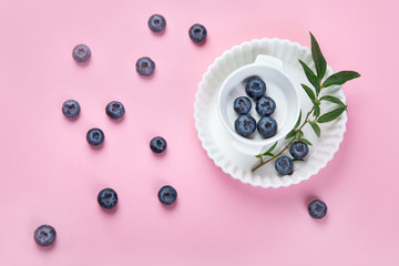Fresh blueberries on pink background
