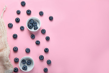 Fresh blueberries on pink background