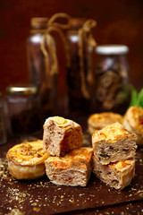 Healthy food with bread, egg, meat, bottles on dark brown background