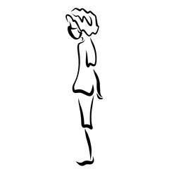 boy in a medical mask stands and holds his hands behind his back