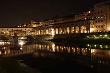 Fototapeta na wymiar View of Ponte Vecchio bridge at night in Florence, Tuscany, Italy