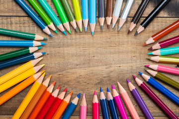 color pencil on wood background, back to school concept
