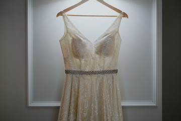 wedding dress on a hanger