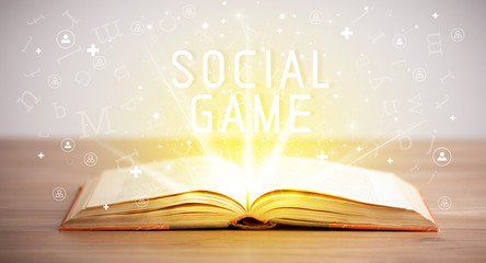 Open book with SOCIAL GAME inscription, social media concept