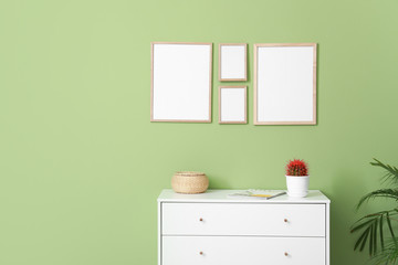 Interior of room with blank picture frames
