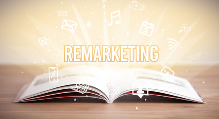 Opeen book with REMARKETING inscription, business concept