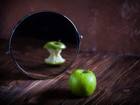 Apple reflecting in the mirror surrealistic picture abstract vision , concept you are not you how others see you how you see yourself