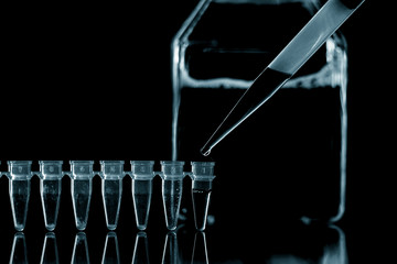  PCR Tube Strips Well  and Pipette in genetic research laboratory close up