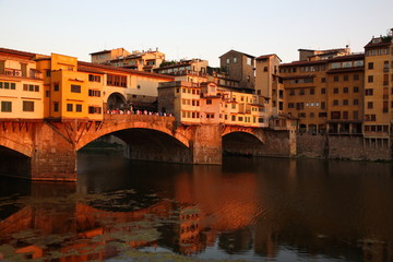 Fototapeta na wymiar View of Ponte Vecchio bridge during sunset in Florence, Tuscany, Italy