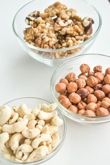 Hazelnuts, cashews, walnuts on a plate. Healthy food, vitamins omega 3, omega 6, calcium, magnesium.