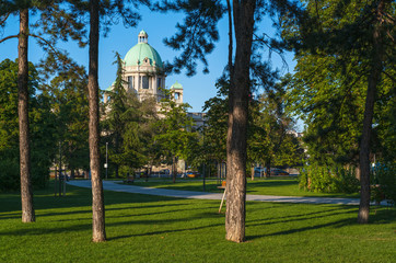 Naklejka premium House of the National Assembly of the Republic of Serbia (Skupstina, construction lasted until 1936) view from summer Pionirski park in the center of city of Belgrade, Serbia, Europe.