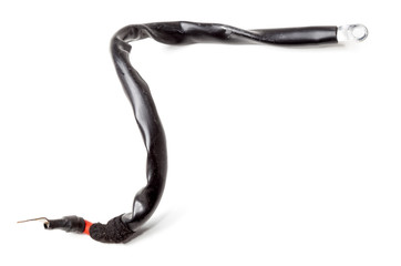 Thick short curved red electric wire in black rubber isolation on a white isolated background. Automotive positive terminal. Auto service industry.