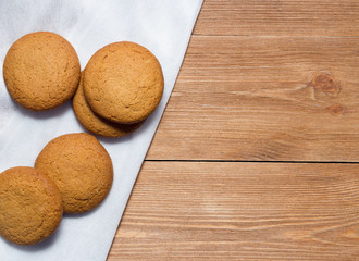 Homemade oatmeal cookie on the wooden background