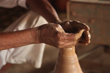 Potter man, clay molding, shaping clay molding potter, potter hand clay mold