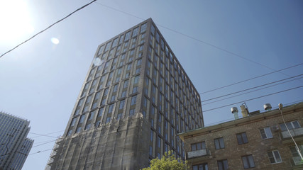 Obraz premium Residential building in New microdistrict. An Apartment Blocks. The building features exterior