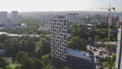 Aerial view of apartment building. Development infrastructure city for big population, modern skyscrapers and tall edifices of megapolis, urban transportation system.