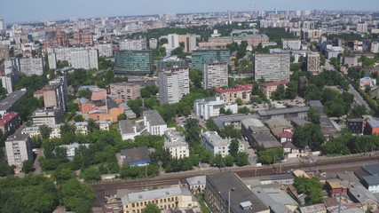 Obraz premium Aerial view of one of the districts of Moscow. Summer weather. Urban cityscape from quadrocopter. Development infrastructure city for big population, urban transportation system.