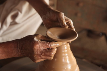 Potter man, clay molding, shaping clay molding potter, potter hand clay mold