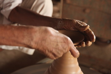 Potter man, clay molding, shaping clay molding potter, potter hand clay mold