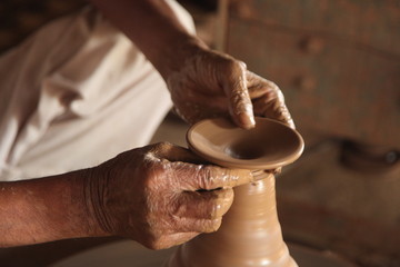 Potter man, clay molding, shaping clay molding potter, potter hand clay mold