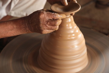 Potter man, clay molding, shaping clay molding potter, potter hand clay mold