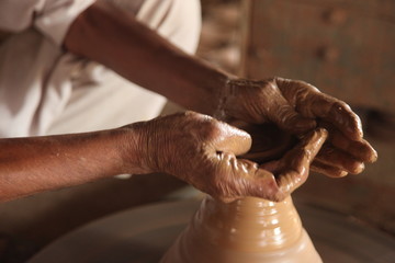 Potter man, clay molding, shaping clay molding potter, potter hand clay mold