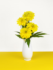 Dissected rudbeckia flowers and leaves in a vase