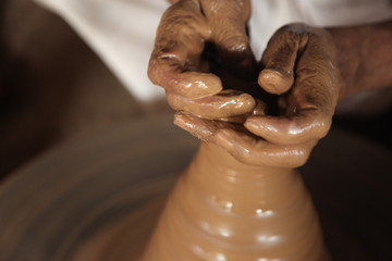 Potter man, clay molding, shaping clay molding potter, potter hand clay mold