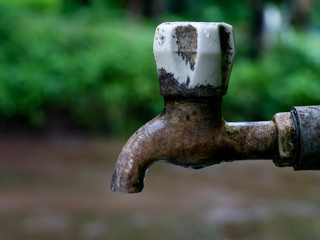 Old plastic water tap in a village house